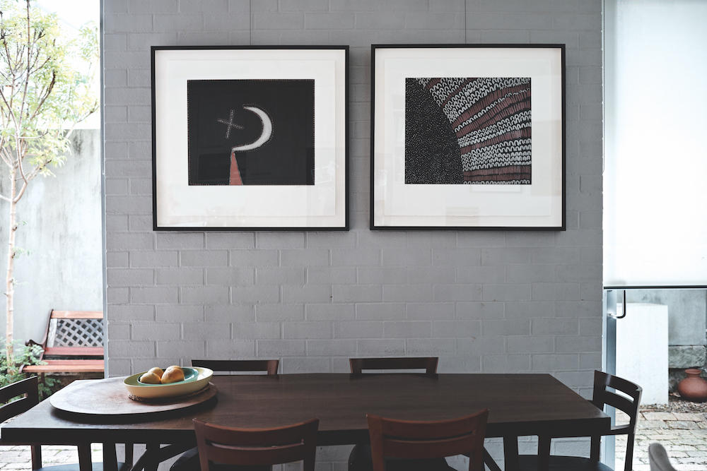 On the left, a limited edition etching by Mabel Juli. On the right, a limited edition etching by Lena Nyadbi.