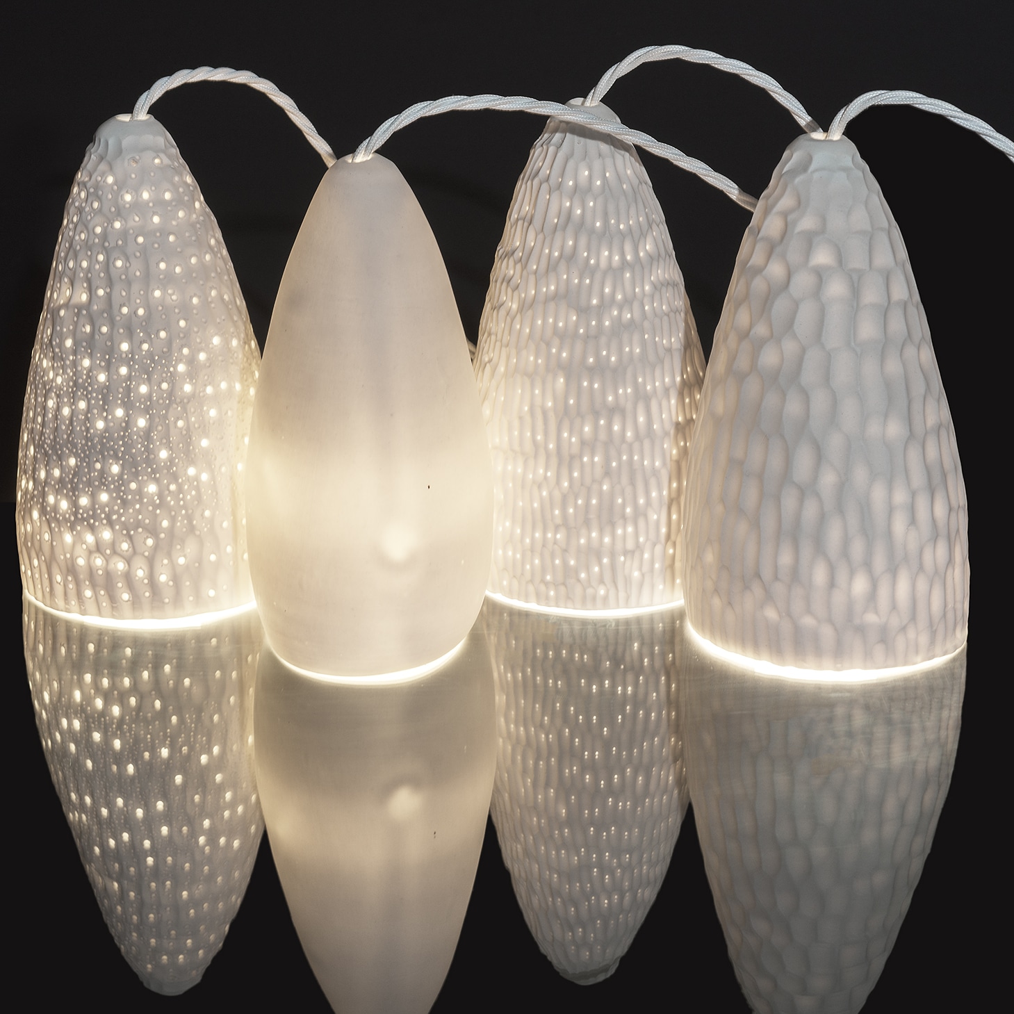Porcelain slip cast and carved Pendant LED light by Jo Victoria